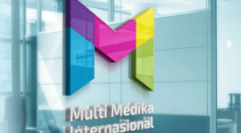 1. Kantor pusat MMIX dengan logo perusahaan, melambangkan strategi baru dan pembagian saham bonus. (Dok. multimed.co.id)